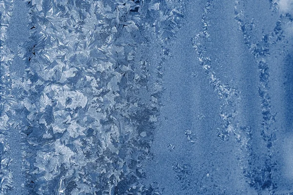 Frosty glass with a silvery blue pattern — Stock Photo, Image