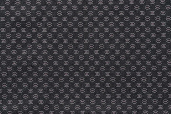 Textuur van donkere stof met een abstracte patroon — Stockfoto