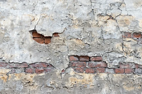 Old brick wall with the peeled plaster — Stock Photo, Image