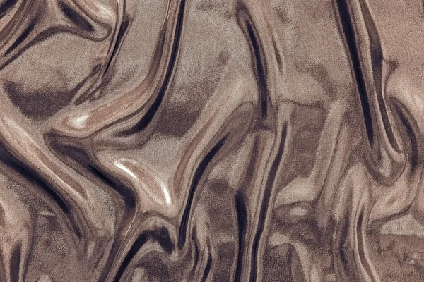 Zerknüllter Stoff von glänzender Schokoladenfarbe — Stockfoto