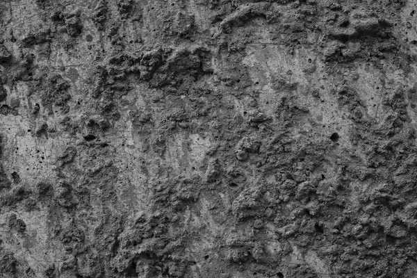 Bumpy texture of black color cement surface — Stock Photo, Image