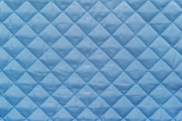 Blue quilted synthetic fabric with grained texture — Zdjęcie stockowe