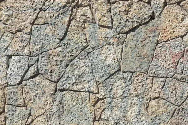 Texture of dark color stone wall with cracks — Stock Photo, Image