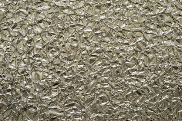 Texture closeup crumpled foil of beige color — 图库照片