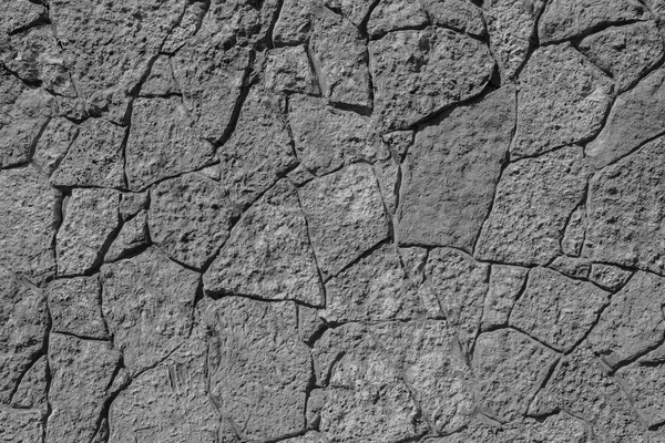 Текстура черного цвета каменная стена с трещинами — стоковое фото