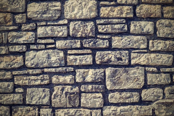 Arka için taştan bir duvar dokusu — Stok fotoğraf