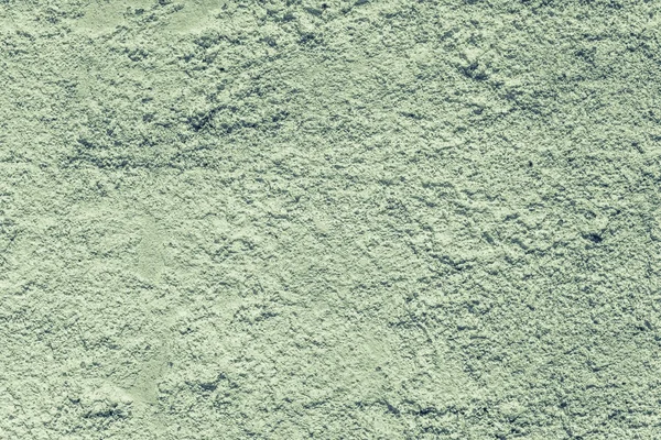 Wall from sandstone with green whitewashing — Stock Photo, Image