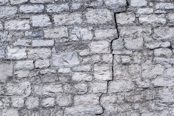 Oude abstracte textuur met spleet van een stenen muur — Stockfoto
