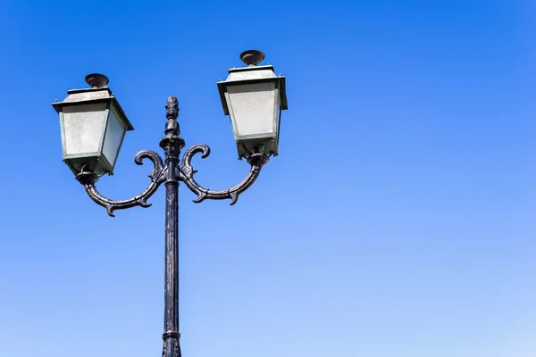 Isolated vintage lamp on an iron column — Stock Photo, Image