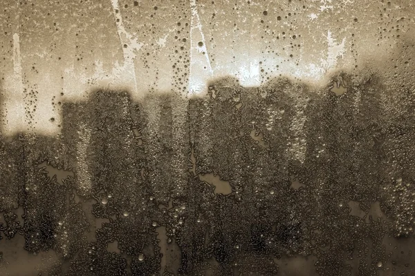 Фантастический абстрактный рисунок замороженной воды на стекле — стоковое фото