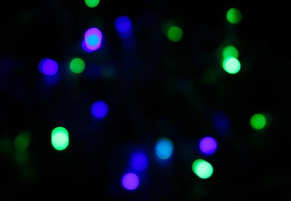 Színes Karácsonyi Fények Bokeh Egy Fekete Háttér — Stock Fotó