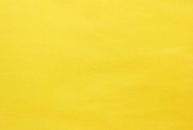 Elbise dikmek için sarı kumaş dokusu