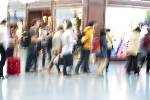 People silhouettes in motion blur, airport interior — Stock Photo, Image