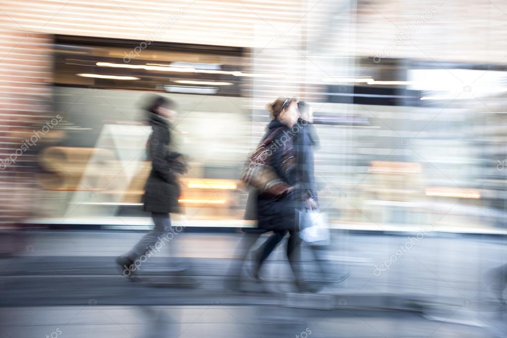 People walking in shopping centre,  zoom effect, motion blur