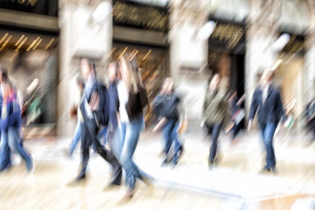 Urban move, people walking in city, motion blur, zoom effect