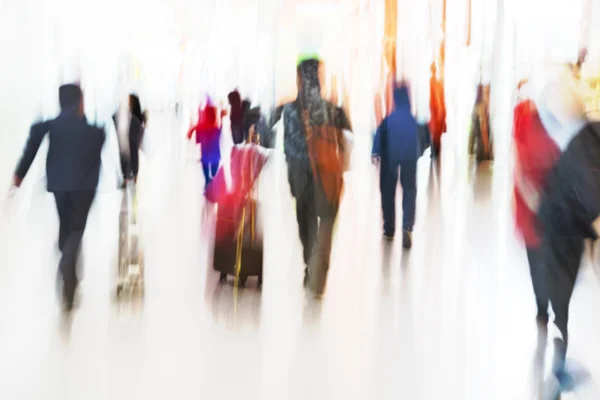 People Rushing at Airport in Motion Blur