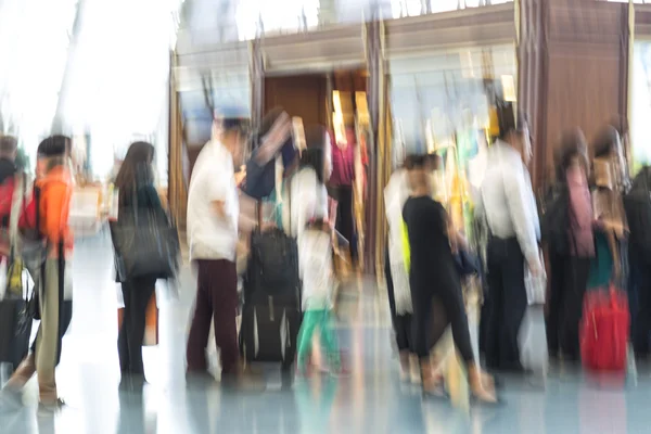 Blurred airport, traveler silhouettes in motion blur — Stock Photo, Image