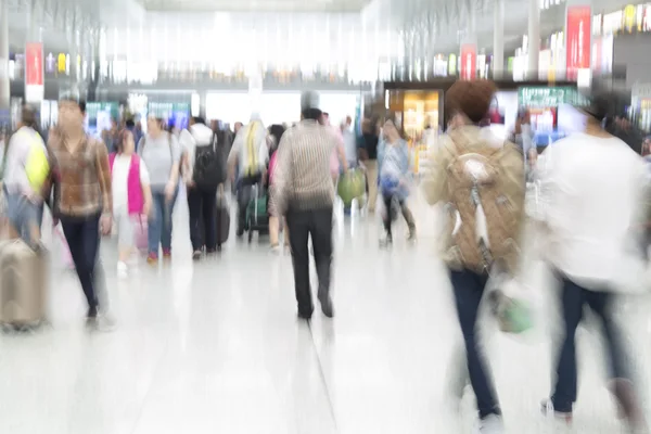 People in motion blur, airport interior — Stock Photo, Image