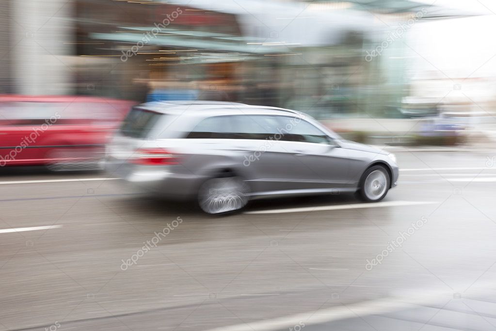 Cars Driving Fast in City