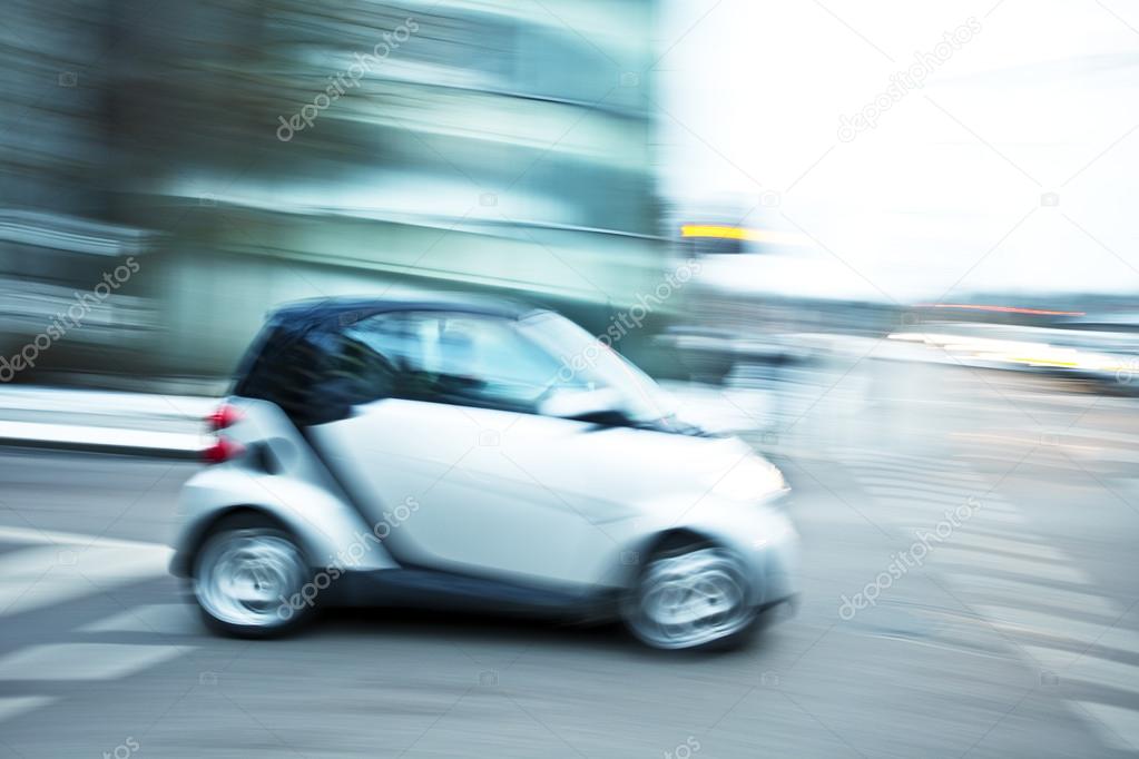 Cars driving fast in city