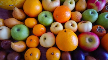 Meyve arkaplanı. Elma, portakal, armut, hurma, erik..
