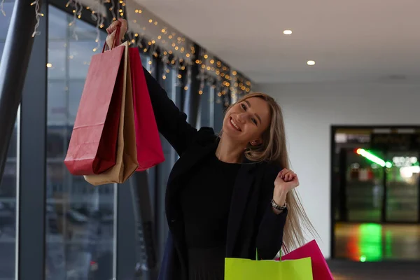 A young woman is happy after shopping