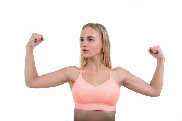 Una Joven Con Top Rosa Muestra Sus Músculos Sobre Fondo — Foto de Stock