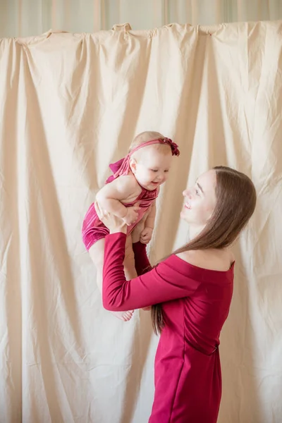 Young Mother Long Dark Hair Burgundy Dress Baby Her Arms — Stock Photo, Image