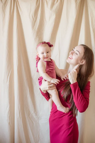 Young Mother Long Dark Hair Burgundy Dress Baby Her Arms — Stock Photo, Image