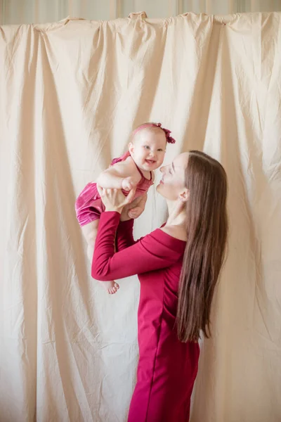 Young Mother Long Dark Hair Burgundy Dress Baby Her Arms — Stock Photo, Image