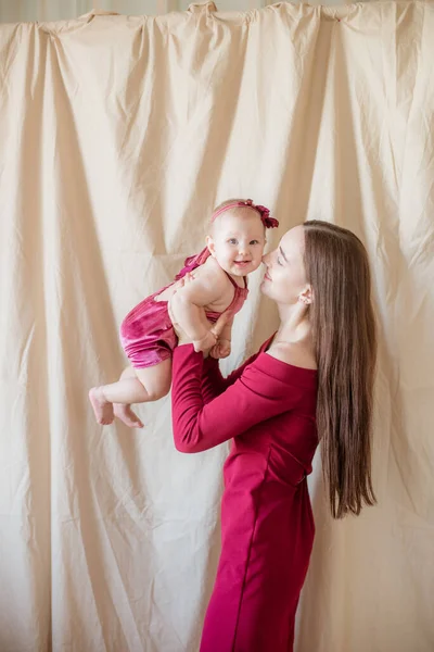 Young Mother Long Dark Hair Burgundy Dress Baby Her Arms — Stock Photo, Image