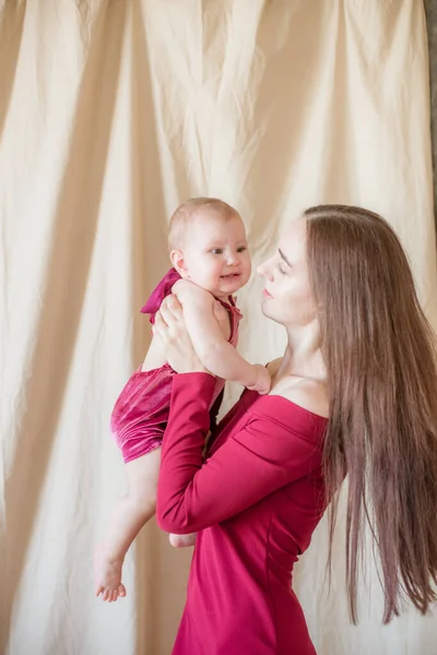 Young Mother Long Dark Hair Burgundy Dress Baby Her Arms — Stock Photo, Image