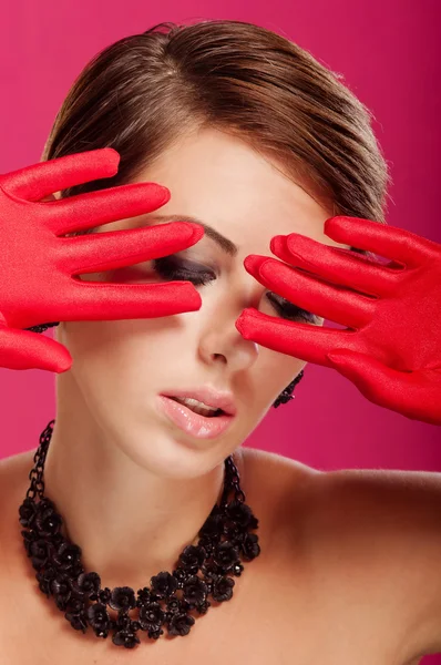 Beautiful girl in red gloves — Stock Photo, Image