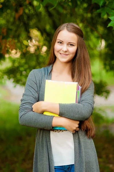 Teen girl with books in hands Royalty Free Stock Photos