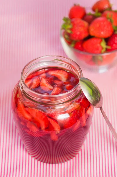 Jar of strawberry jam on  table — Stock Photo, Image