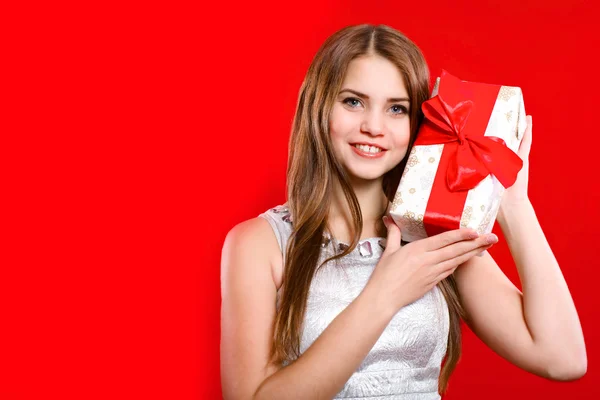 Beautiful girl with long hair with gift box — Stock Photo, Image
