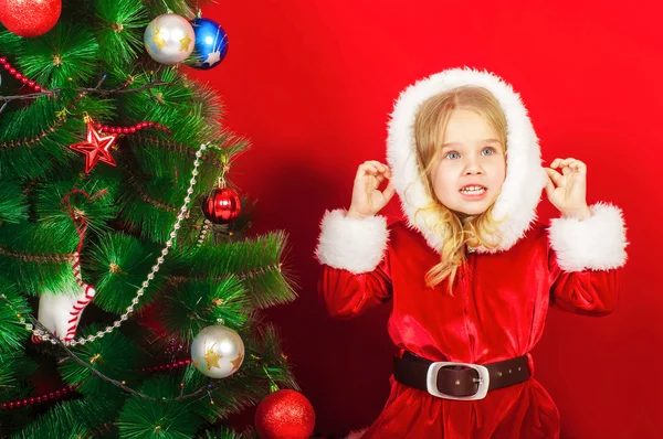 Little girl near the Christmas tree — Stock Photo, Image