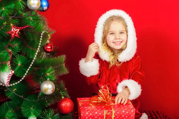 Little girl near the Christmas tree Royalty Free Stock Photos