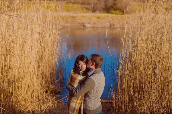 Couple in love near the river in the spring — Stock Photo, Image