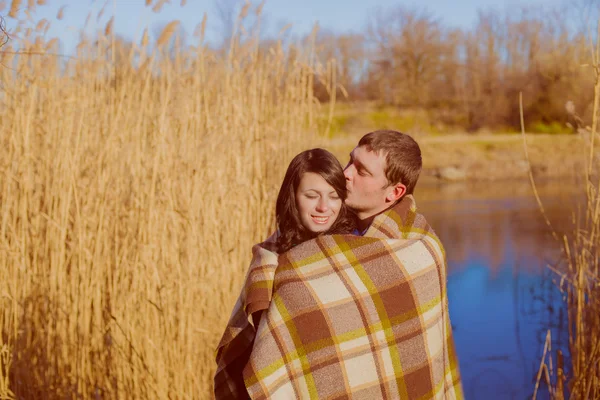 Couple in love near the river in the spring — Stock Photo, Image