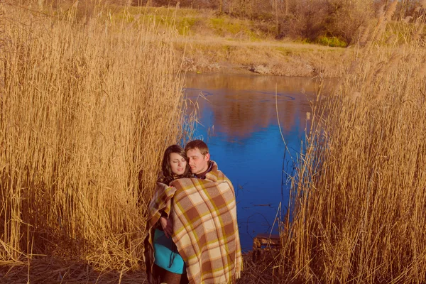 Couple in love near the river in the spring — Stock Photo, Image