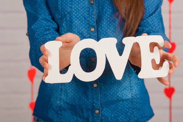 Hands of a  girl with word love — Stock Photo, Image