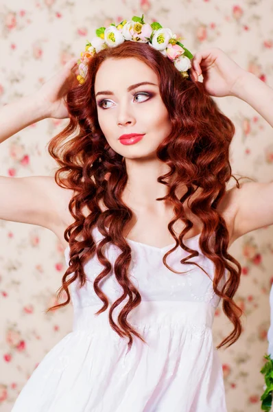 Girl with long hair in a wreath — Stock Photo, Image