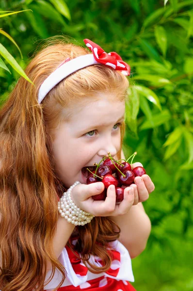 Girl in a  dress in cherry garden — Stock Photo, Image