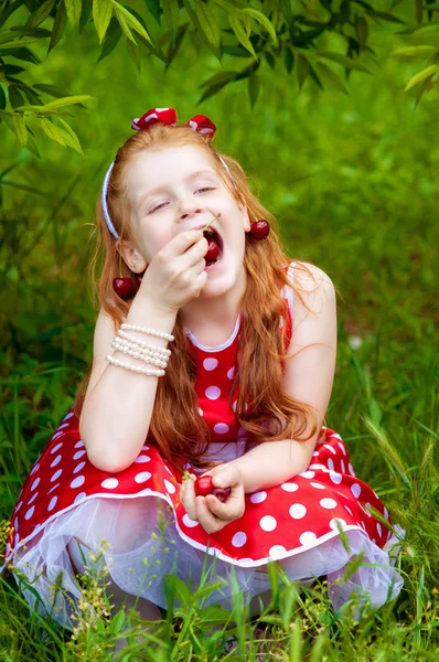 Girl in a  dress in cherry garden — Stock Photo, Image