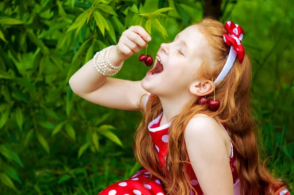 Girl in a  dress in cherry garden — Stock Photo, Image