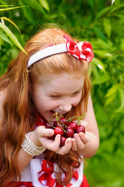 Girl in a  dress in cherry garden — Stock Photo, Image