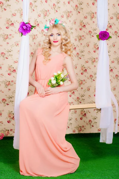 Girl with long hair in a flower wreath — Stock Photo, Image