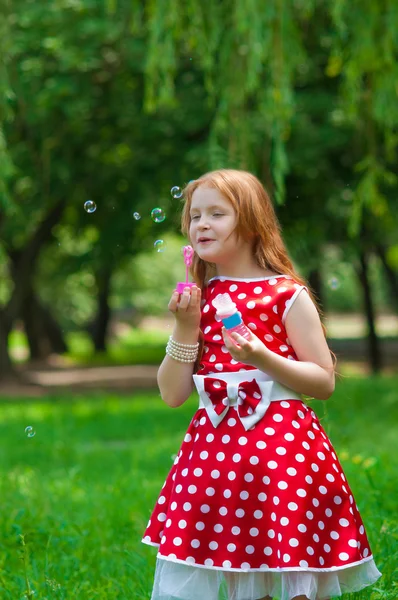 Beautiful dress girl with soap bubbles — Stock Photo, Image