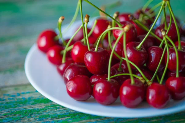 Cherry on a plate on  table — Stock Photo, Image